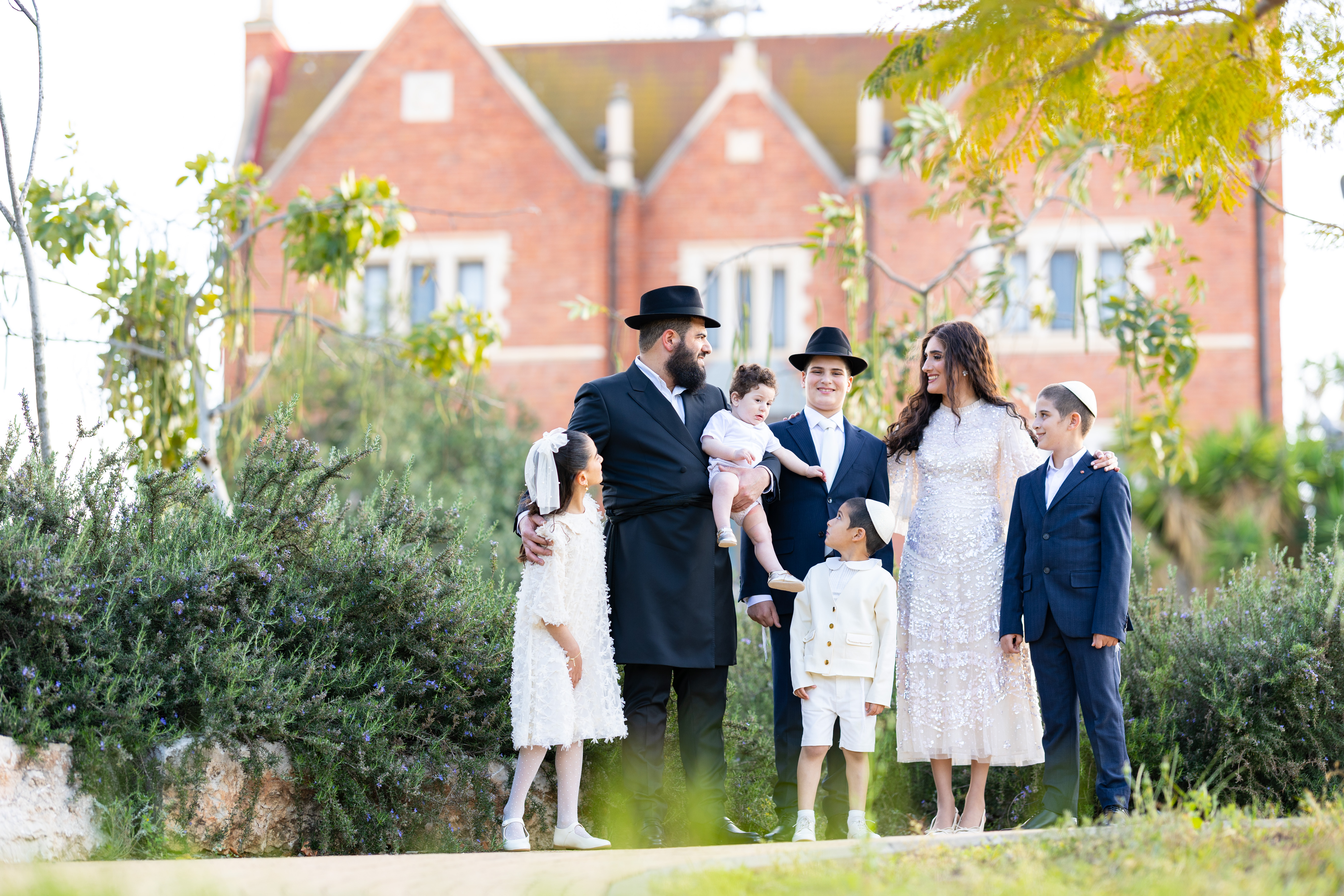 A family celebrating a Bar Mitzvah outdoors